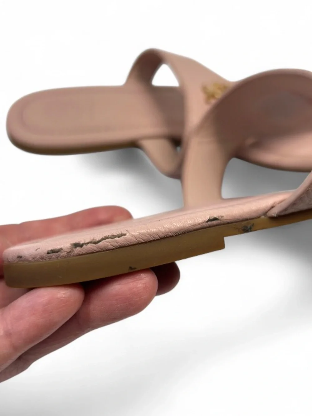 the Tory Burch Jolie Flat Thong Sandals in Sea Shell Pink tumbled leather. 6.5